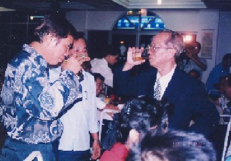 Grandmaster Wong drinking to the health of Patriarch Ho Fatt Nam